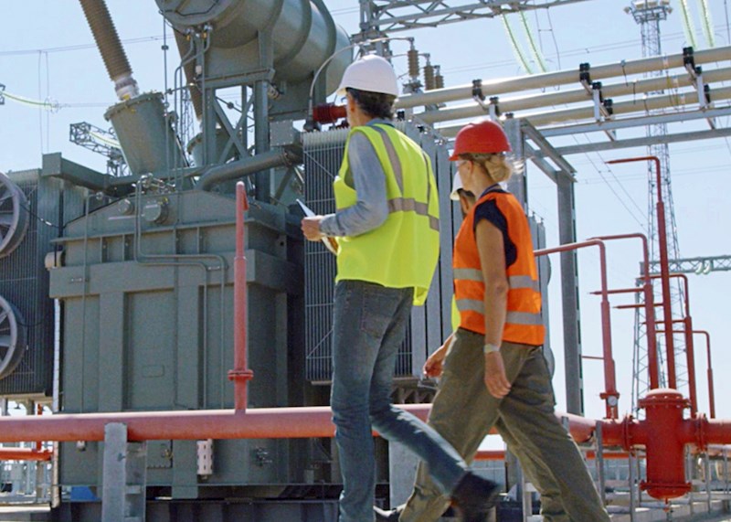 Construction workers at a power plant