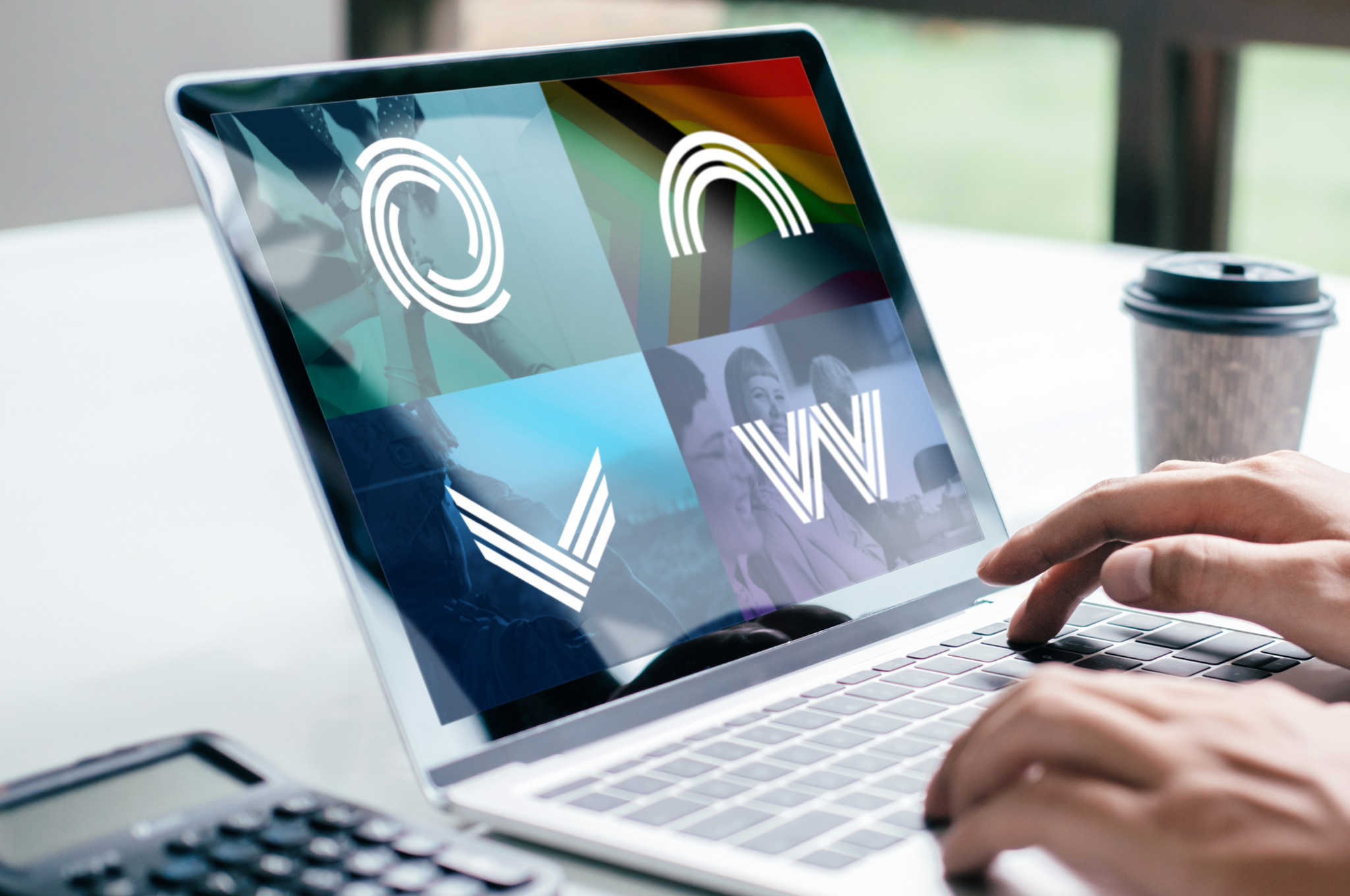 Closeup of hands on a laptop; BRG logos are on the screen