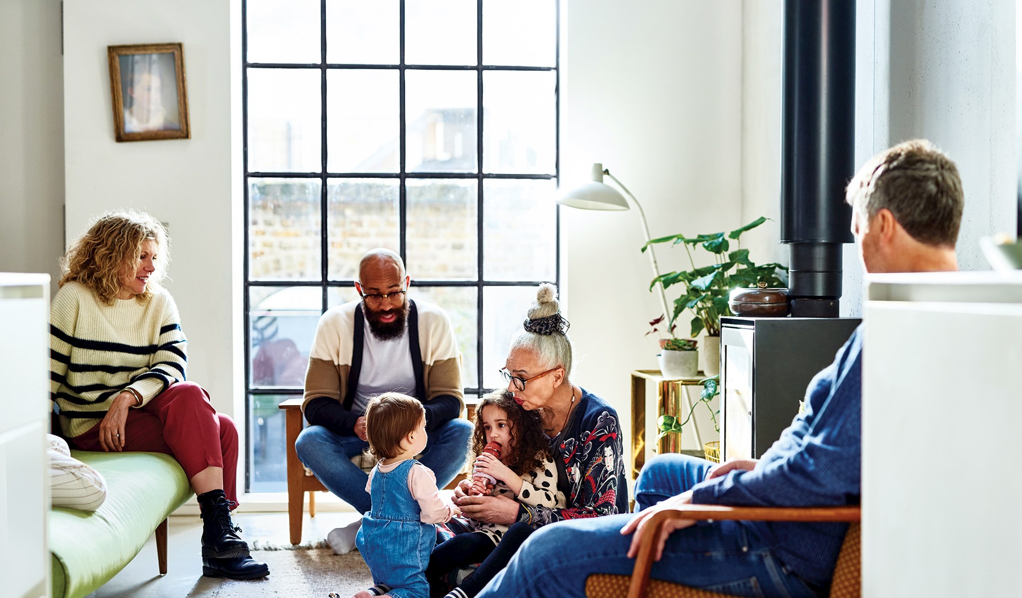 Family sitting in a family room